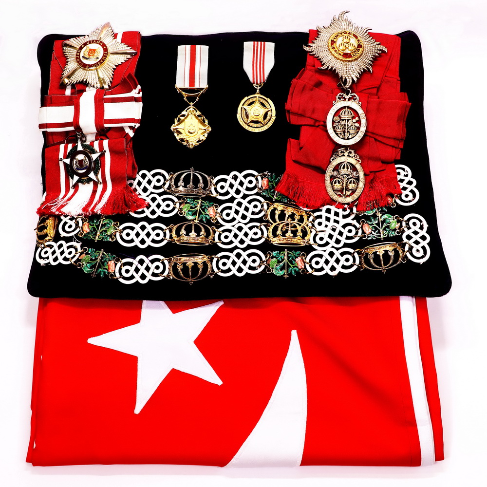 Medals pinned on State flag (placed on top of his coffin)